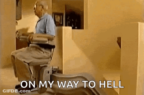 An Elderly Man Is Sitting In A Wheelchair With The Words `` On My Way To Hell '' Written On The Bottom . GIF