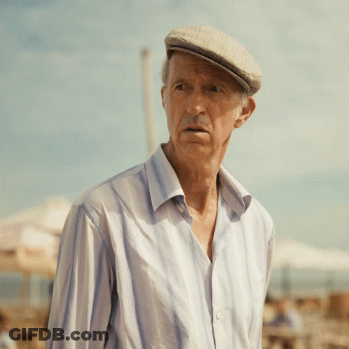 An Elderly Man Wearing A Hat And A Striped Shirt GIF