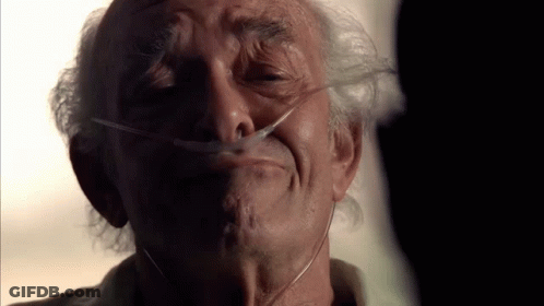 An Elderly Man With An Oxygen Mask On His Face GIF