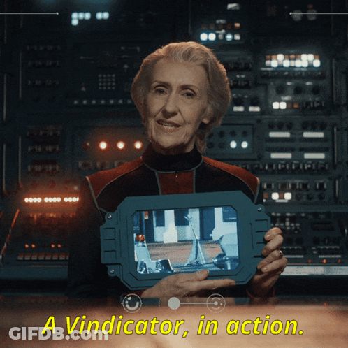 An Elderly Woman Holding A Device That Says Aviminator In Action GIF