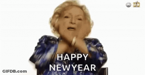 An Elderly Woman In A Blue Jacket Is Saying `` Happy New Year '' . GIF