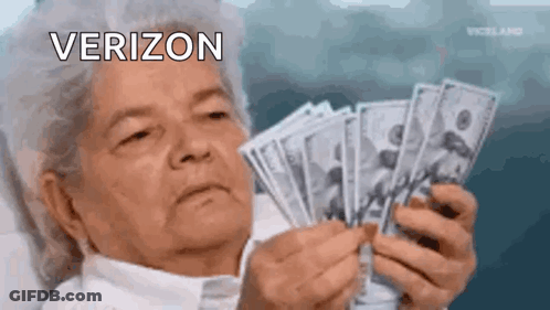 An Elderly Woman Is Holding A Bunch Of Money In Her Hands And Looking At It . GIF