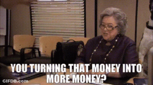 An Elderly Woman Is Sitting At A Desk Talking To Someone And The Words You Turning That Money Into More Money GIF
