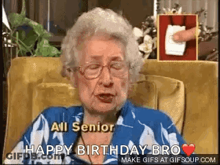 An Elderly Woman Is Sitting In A Chair And Saying `` All Senior Happy Birthday Bro `` . GIF