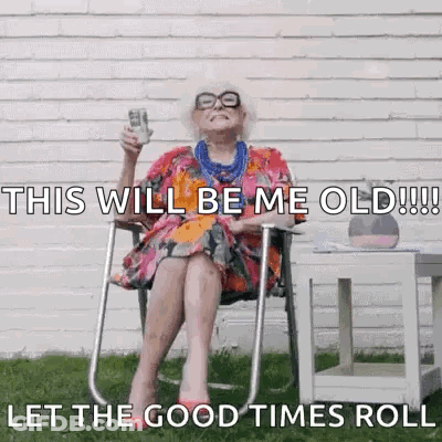 An Elderly Woman Is Sitting In A Chair Holding A Cup Of Coffee And A Bottle Of Beer . GIF