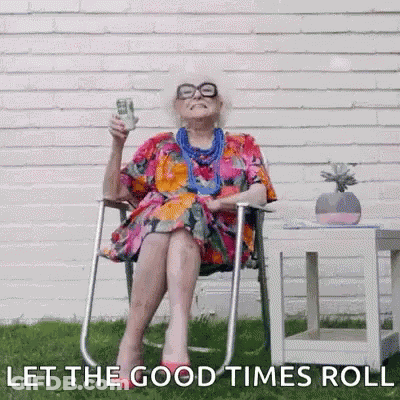 An Elderly Woman Is Sitting In A Chair Holding A Dollar Bill And A Glass Of Beer . GIF