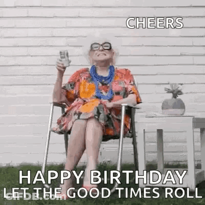 An Elderly Woman Is Sitting In A Chair Holding A Glass Of Wine And A Bottle Of Beer . GIF