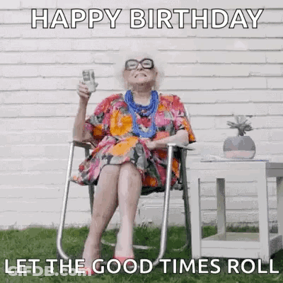 An Elderly Woman Is Sitting In A Chair Holding A Glass Of Wine And A Stack Of Money . GIF