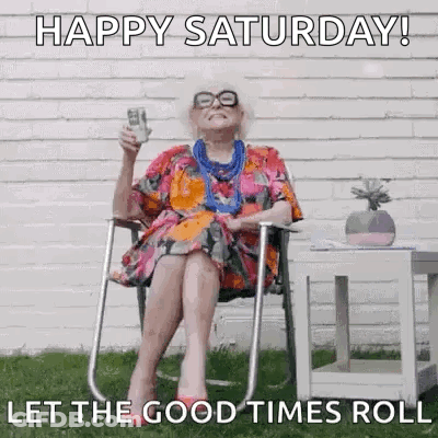 An Elderly Woman Is Sitting In A Folding Chair Holding A Glass Of Beer . GIF