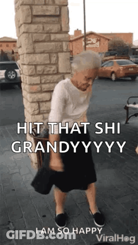 An Elderly Woman Is Standing In Front Of A Brick Wall Holding A Purse . GIF
