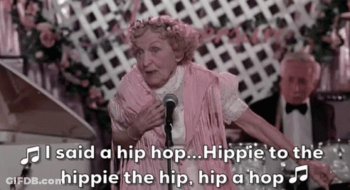 An Elderly Woman Singing Into A Microphone With The Words I Said A Hip Hop Hippie To The Hippie GIF