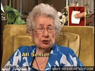 An Elderly Woman Sitting In A Chair With The Words All Senior Written On Her Chest GIF