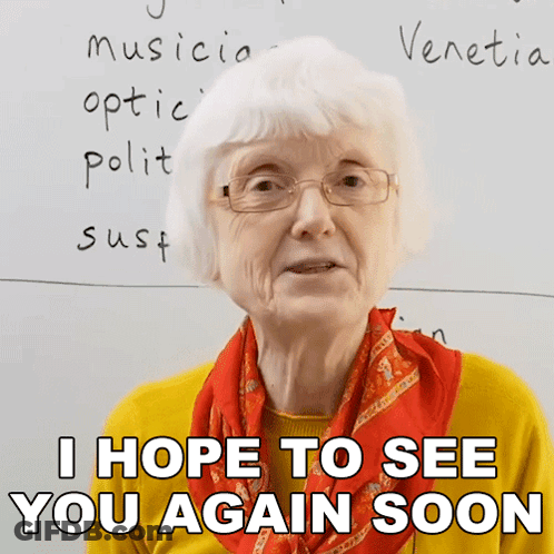 An Elderly Woman Wearing Glasses And A Scarf Says I Hope To See You Again Soon GIF