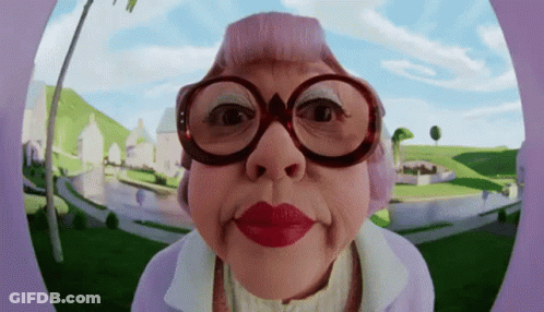 An Elderly Woman Wearing Glasses And Red Lipstick GIF
