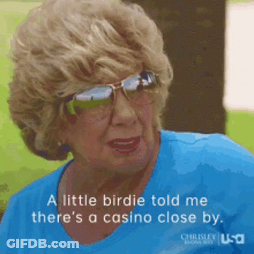 An Elderly Woman Wearing Sunglasses And A Blue Shirt Says A Little Birdie Told Me There 'S A Casino Close By GIF