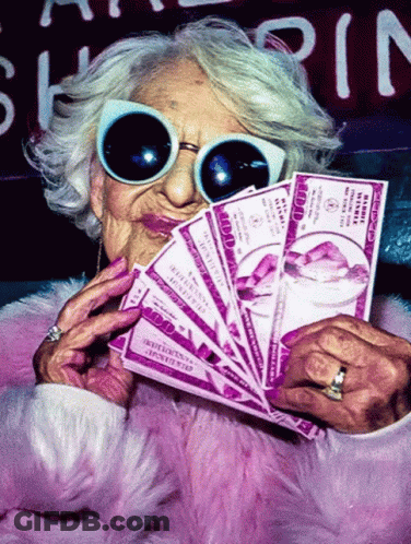 An Elderly Woman Wearing Sunglasses Holds A Fan Of Hundred Dollar Bills In Her Hand GIF