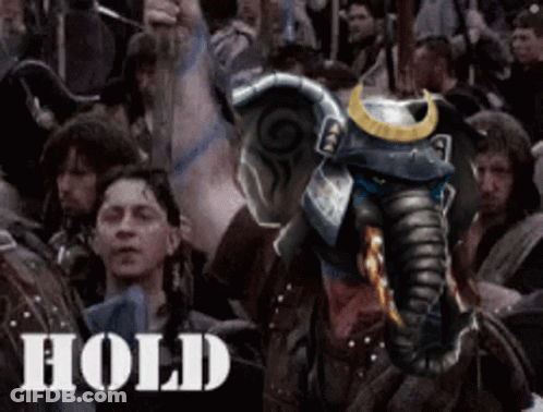 An Elephant With A Samurai Helmet Is In A Crowd Of People And The Word Hold Is On The Bottom Right GIF