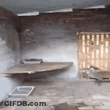 An Empty Room With A Shelf And A Tray On The Floor . GIF