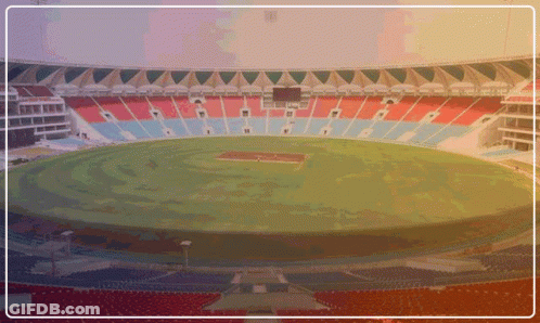 An Empty Stadium With Red Blue And White Seats GIF