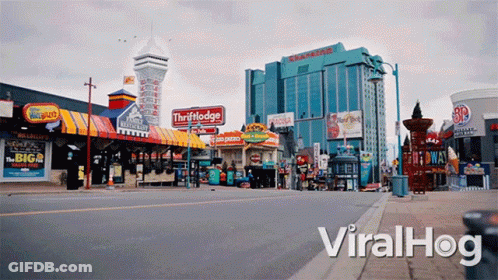 An Empty Street With A Sign That Says Viralhog GIF