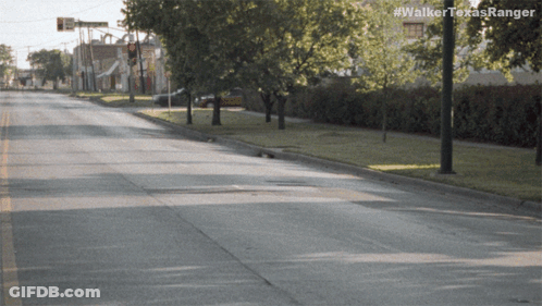 An Empty Street With The Hashtag #Walkertexasranger On The Bottom GIF