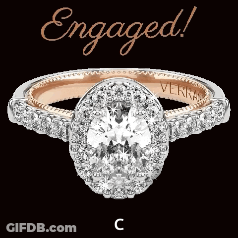 An Engagement Ring With The Word Engaged Written Above It GIF