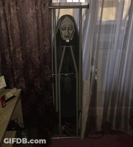 An Ironing Board With A Nun On It GIF