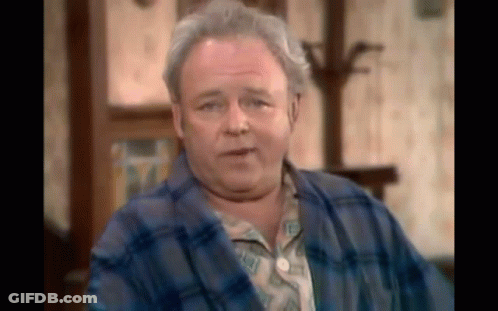 Older Man In Blue Plaid Robe Sitting GIF