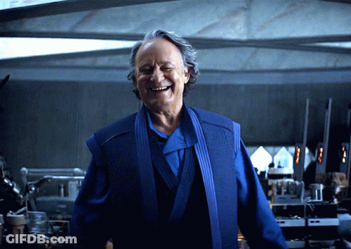 Smiling Man In Blue Robe GIF