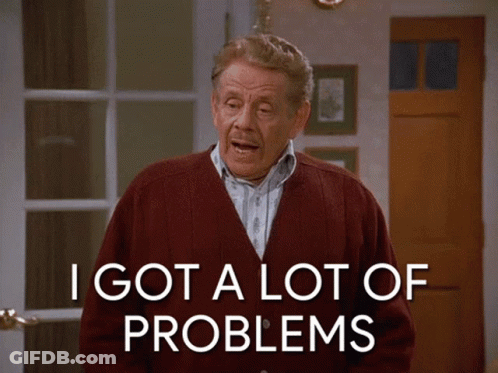 An Older Man In A Red Cardigan Says I Got A Lot Of Problems GIF