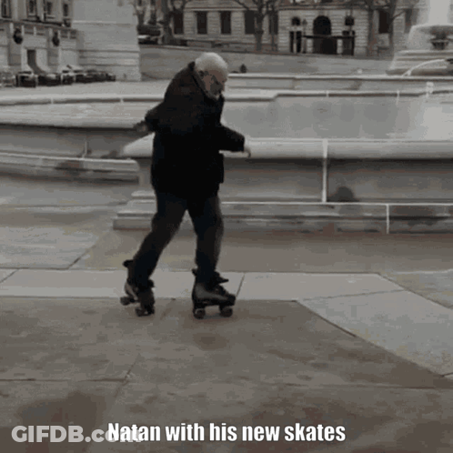 An Older Man Is Rollerblading In Front Of A Fountain And The Caption Natan With His New Skates GIF