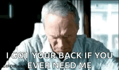 An Older Man Is Sitting At A Desk And Says `` I Got Your Back If You Ever Needed Me '' . GIF