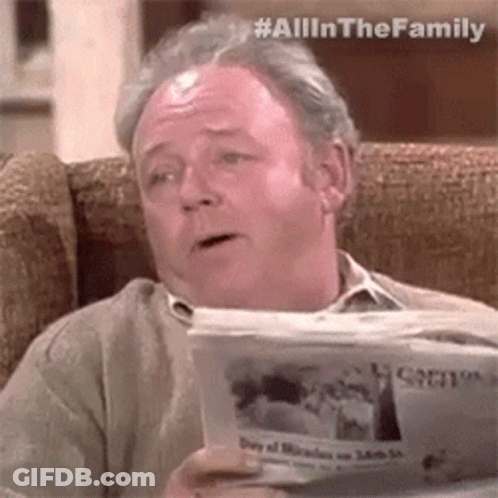Older Man Sitting With Newspaper GIF