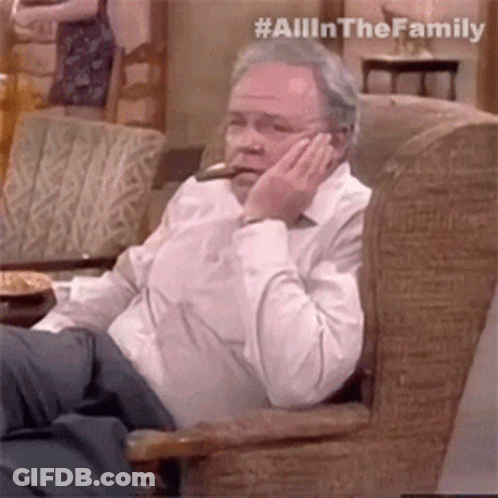 Older Man Smoking Cigar And Talking On Phone GIF