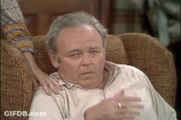 Older Man Sitting With Woman's Arm On Shoulder GIF