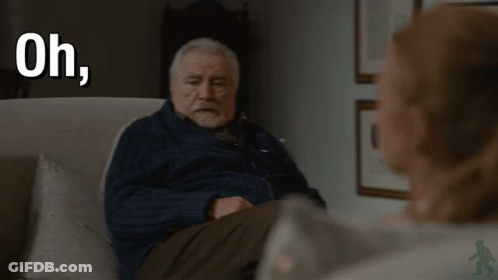 An Older Man Is Sitting In A Chair With The Words Oh Fuck Off Behind Him GIF