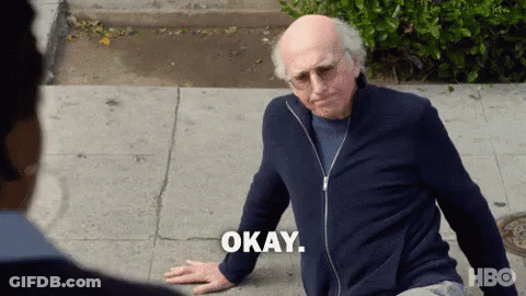 An Older Man Is Sitting On The Sidewalk And Says Okay GIF