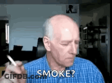 An Older Man Is Smoking A Cigarette And Asking If He Should Smoke ? GIF