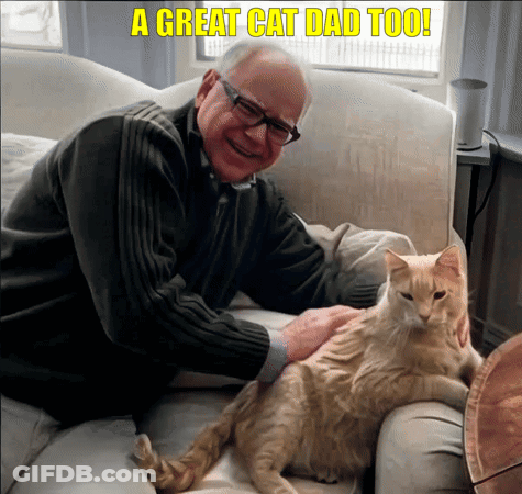 An Older Man Petting A Cat On A Couch With The Caption A Great Cat Dad Too ! GIF