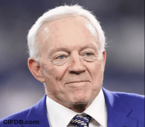 An Older Man Wearing A Blue Suit And Tie GIF