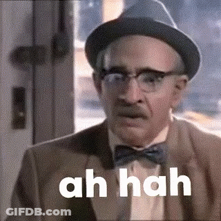 An Older Man Wearing A Hat And Bow Tie Is Making A Funny Face And Saying Ah Hah . GIF