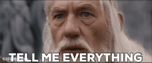 An Older Man With A Beard And Mustache Says Tell Me Everything GIF