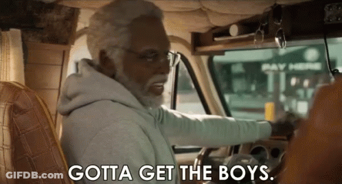 An Older Man With A Beard Is Driving A Van And Saying `` Gotta Get The Boys '' . GIF
