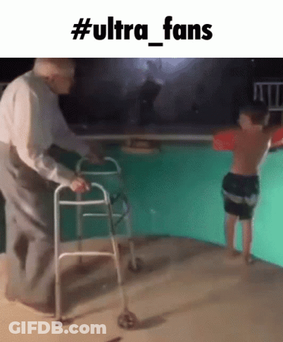 An Older Man With A Walker Helps A Young Boy Into A Pool GIF