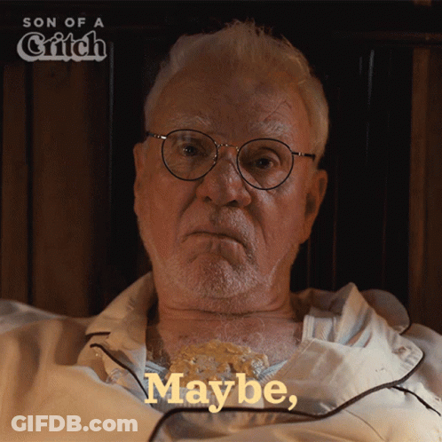 An Older Man With Glasses Is Laying In Bed With The Words Maybe On The Bottom Right GIF