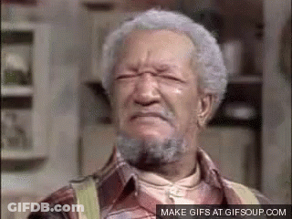An Older Man With Gray Hair And A Beard Is Making A Face . GIF