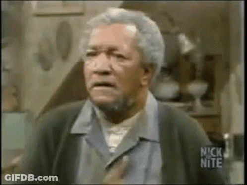 An Older Man With Gray Hair And A Beard Is Making A Funny Face In A Room . GIF