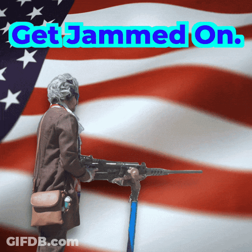 An Older Woman Holding A Gun In Front Of An American Flag With The Words Get Jammed On GIF