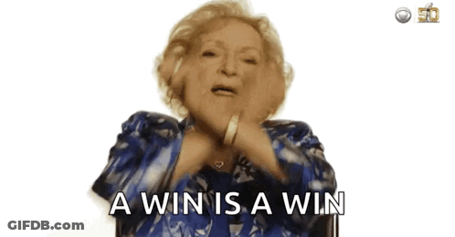 An Older Woman In A Blue Jacket Is Saying A Win Is A Win GIF