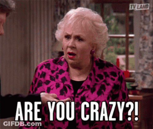 An Older Woman In A Pink Jacket Is Asking If She Is Crazy GIF